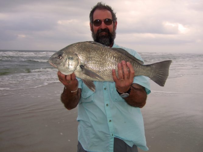 Neil Mackellow with a shore caught fish abroad