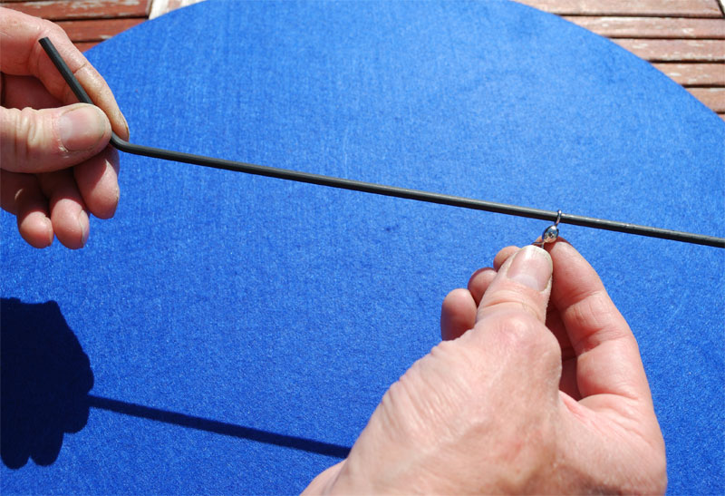 sliding the swivel on to the tube or tubing boom