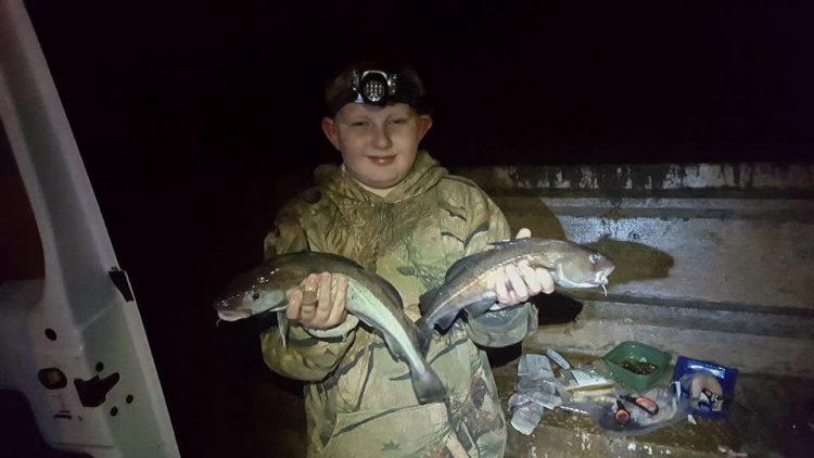 Nine year old Luke Curedon with a brace of codling