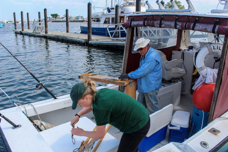 Being checked by Fish and Game officer