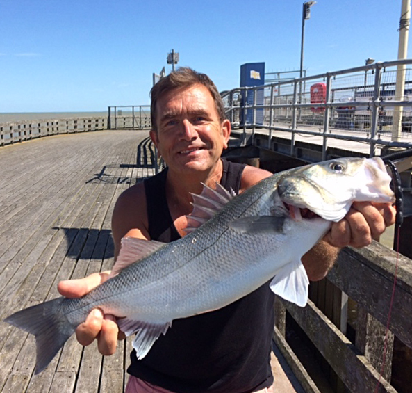 John with a lure caught pier bass
