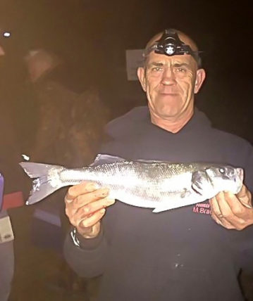 Mick Bradley showing his 2lb 1oz bass