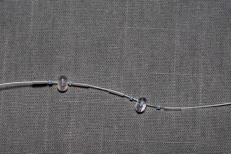 Tubing and two-way beads threaded on trace body