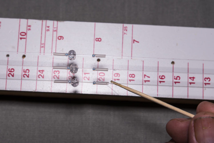 Apply the glue with a cocktail stick