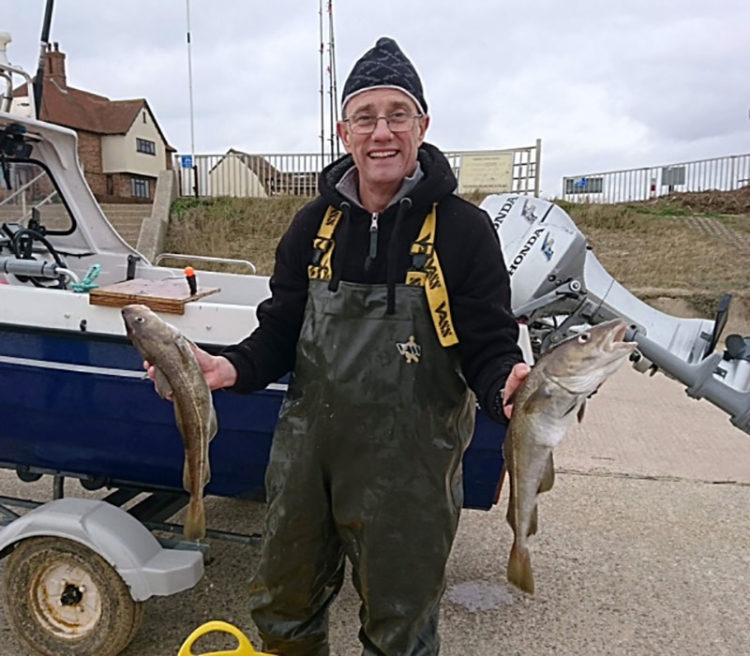 Howard Mason with part of his catch of codling.