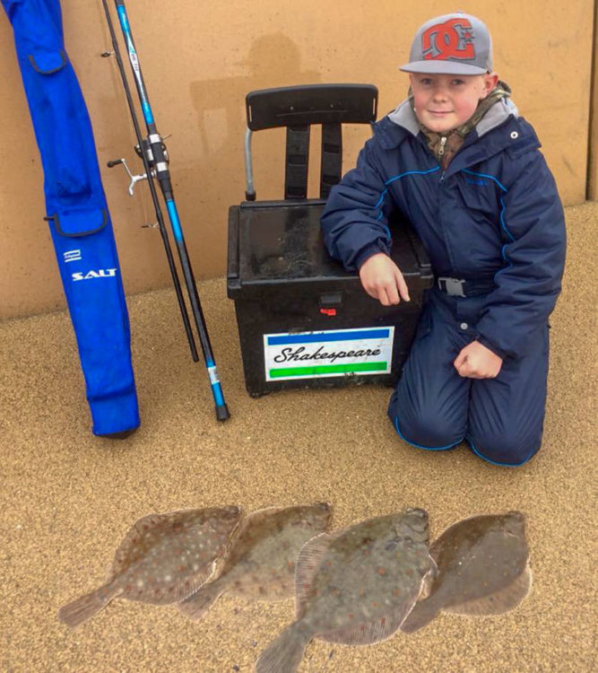 Young Kian with his bag of plaice