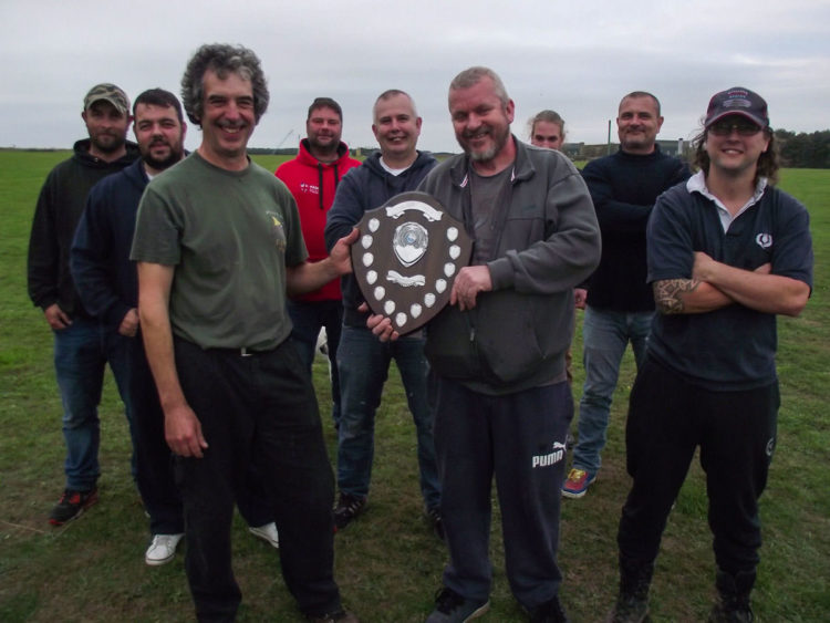 Mark Holmes being presented with the Vanguard Shield by Cain Plumb