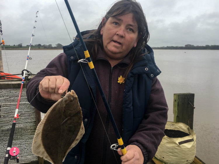 Tracey Howarth with a flounder caught from the pier
