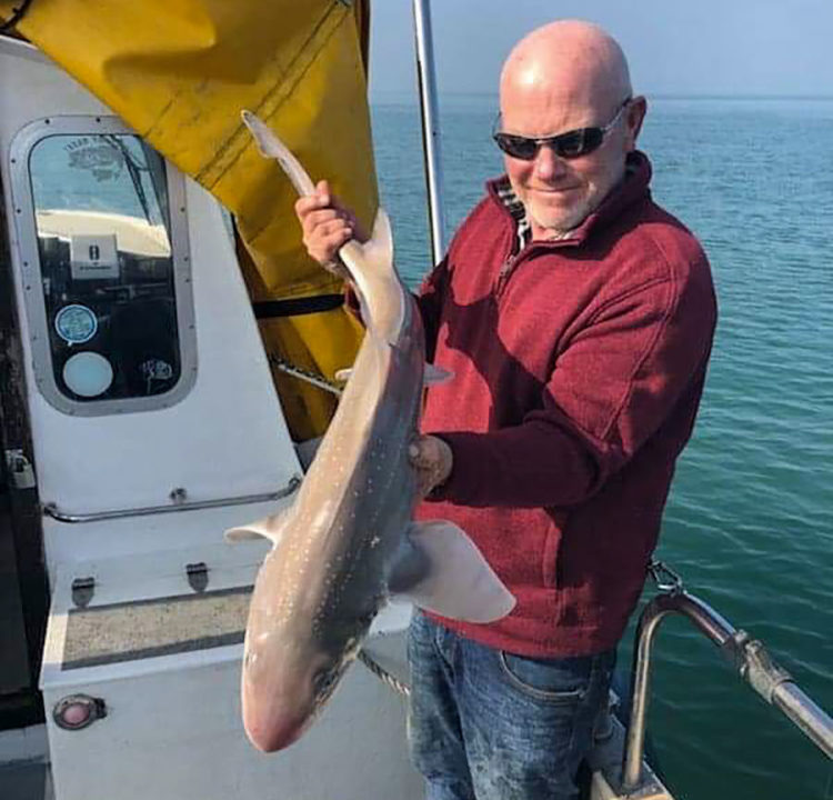 Chris Mole Skipper of the charter boat Enterprise looks very pleased with his early season 10lb smoothhound