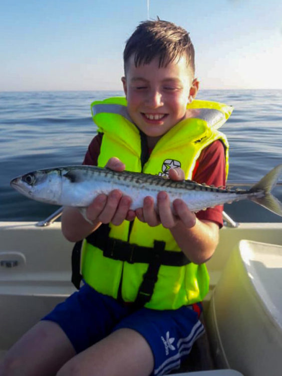 10 year old Tyler Barlow with a nice mackerel