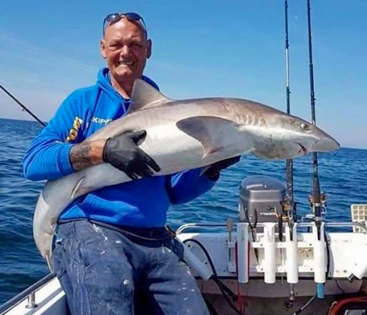 Darren Evans from Fylde Boat Angling Club with a 57lb tope