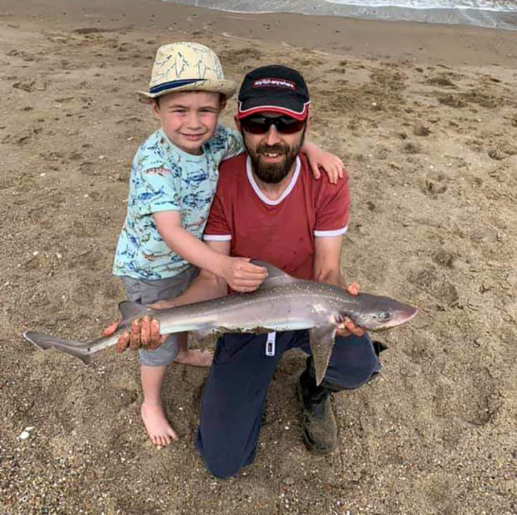 Second placed Mark Taylor and son Rex with the longest round fish