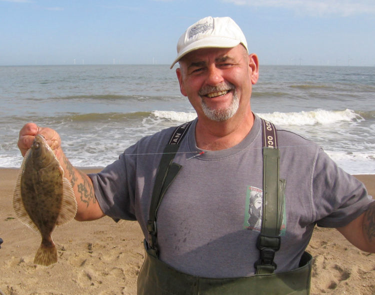 Third placed Simon Drayton posing nicely with one of his two flounders