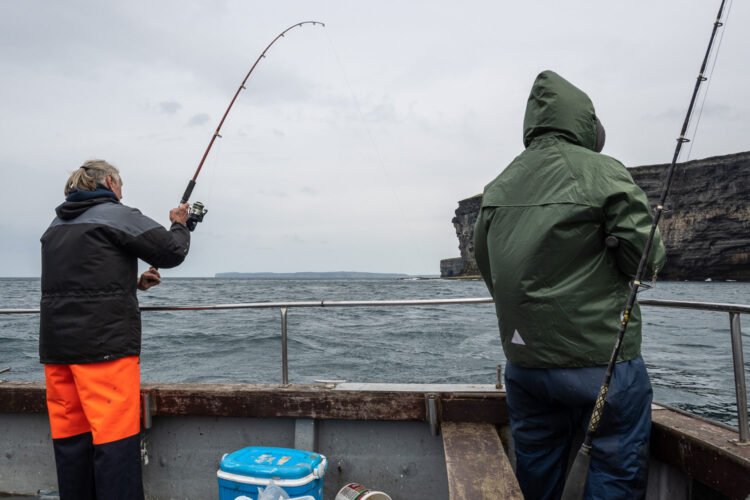 Scrabster fishing under the cliffs