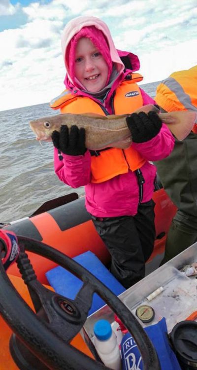 Molly Simpsons age 7 with her catch of the day