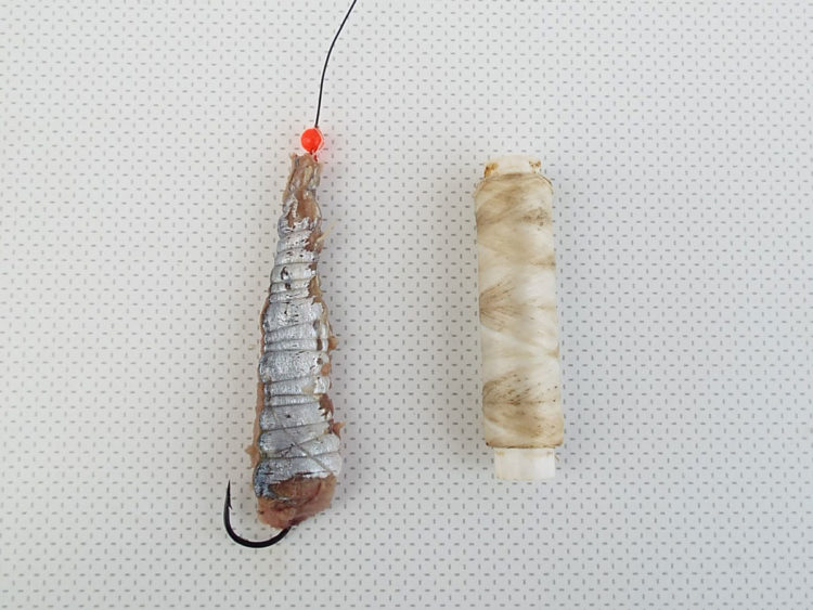 bait wrapped with elastic round bead and stop knot