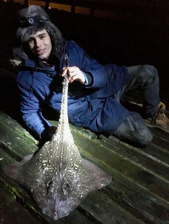 Sam Kennard with a night time thornback ray from Walton pier