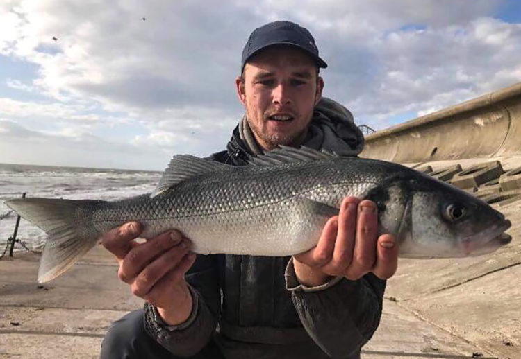 Guy Shaw with a nice bass caught at South Shore